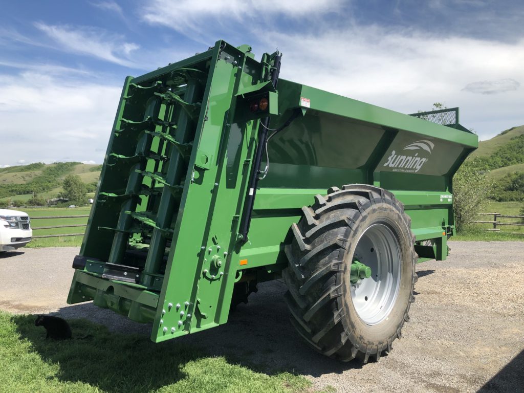 Lowlander 105 TVA with slurry door, stone guard extension, lift off augers and 580/70 R38 wheels